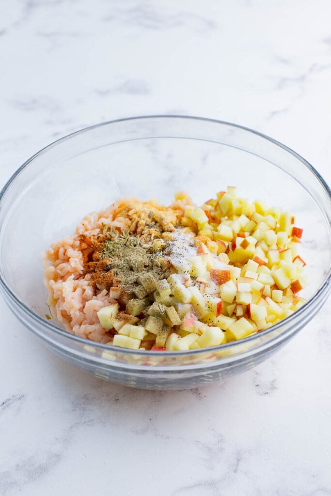 The sausage ingredients are added to a bowl.