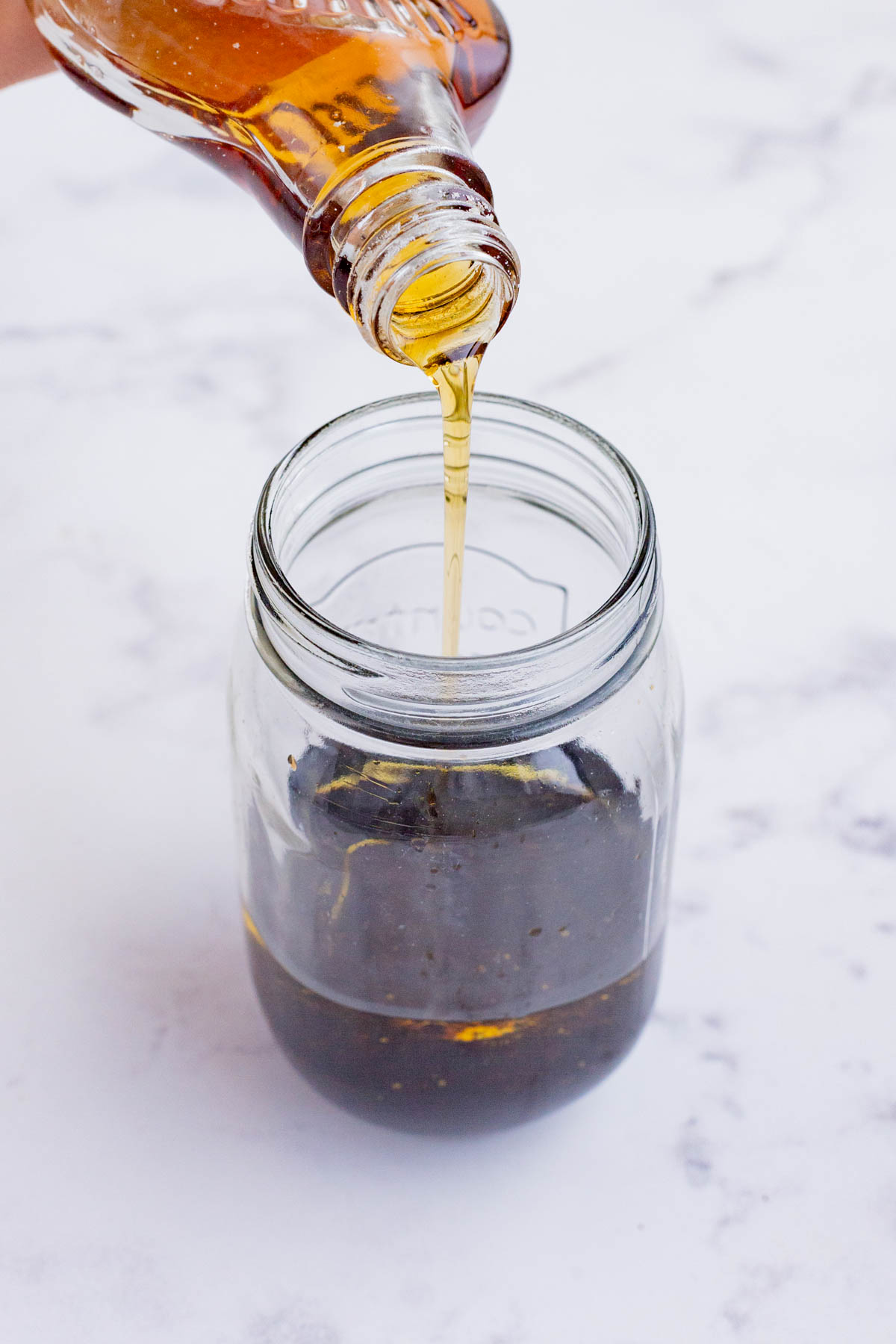 The balsamic vinaigrette is made in a jar.
