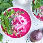 Coconut milk, herbs, and seeds are added to the top of this creamy, winter soup.