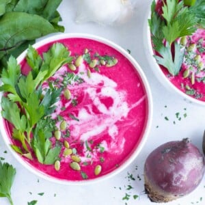 Coconut milk, herbs, and seeds are added to the top of this creamy, winter soup.