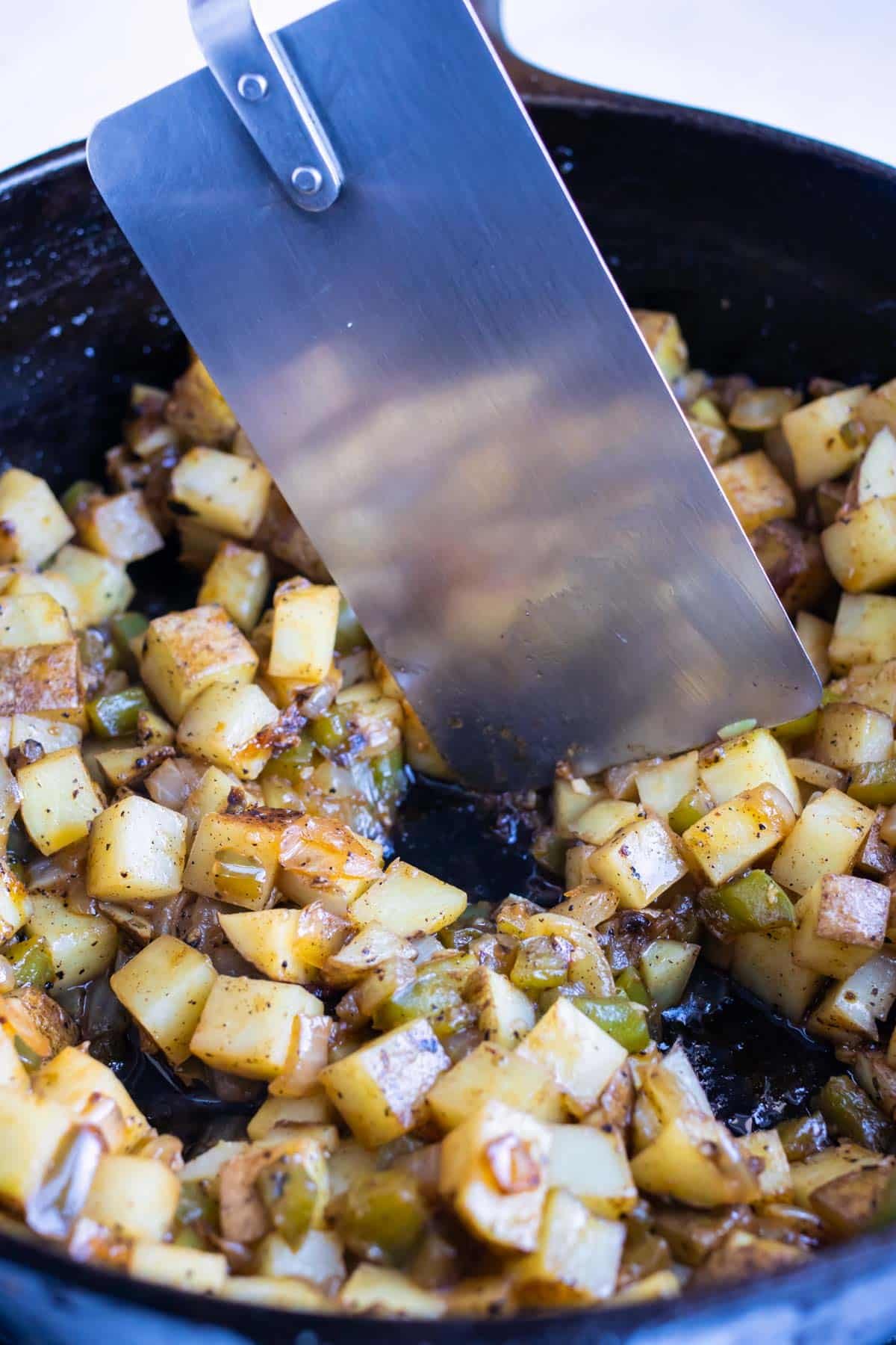 Potatoes and veggies are cooked together in one pot.