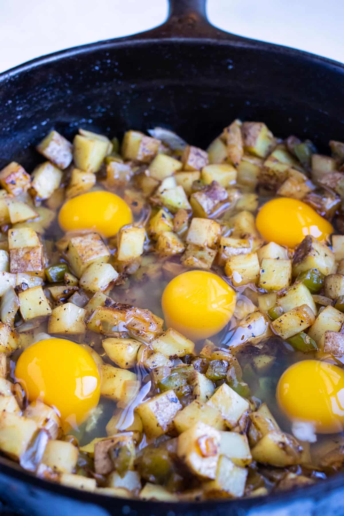 Eggs are added last to the skillet and cooked.