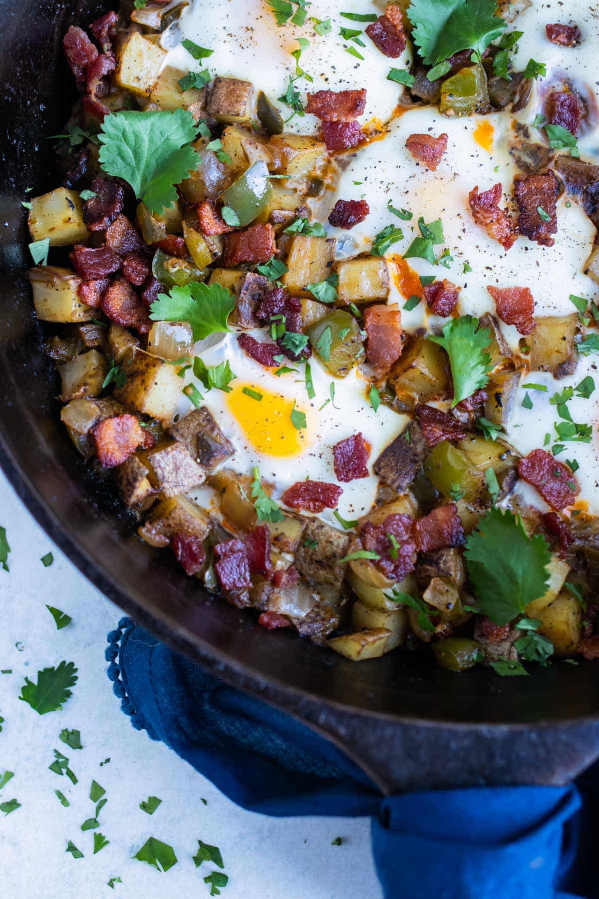 Breakfast hash and egg is set on the counter for a dairy-free recipe.