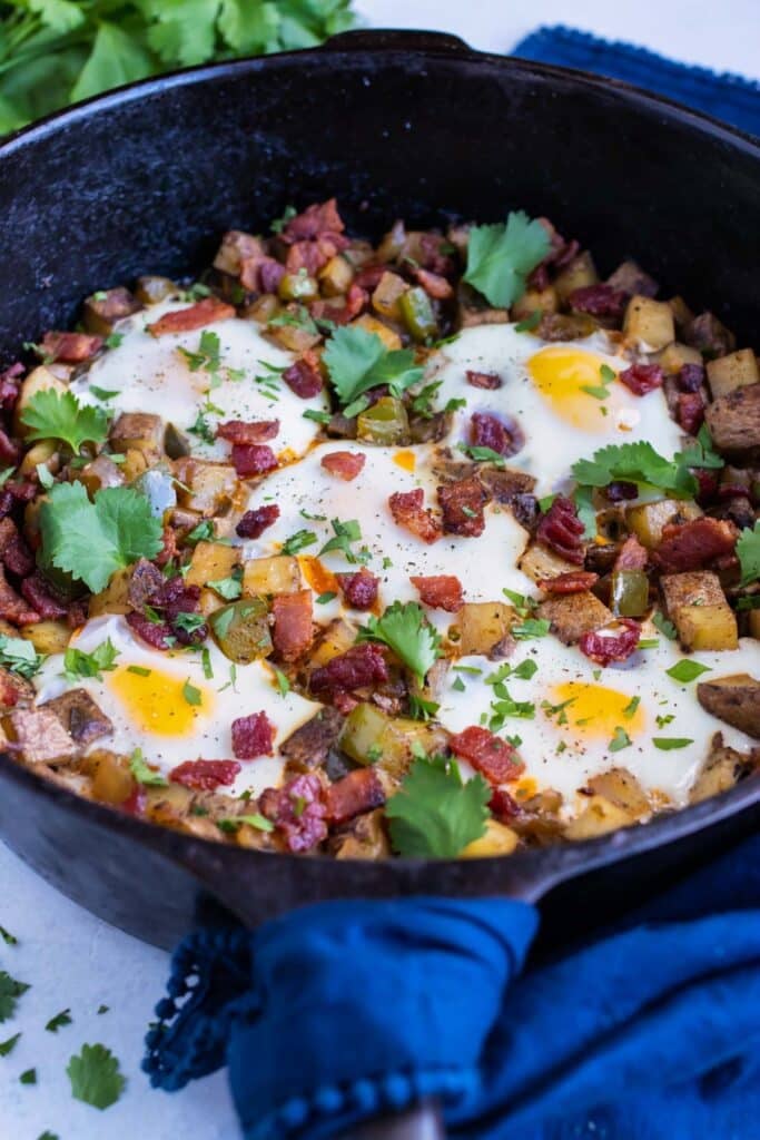 Breakfast hash and egg is set on the counter for a dairy-free recipe.