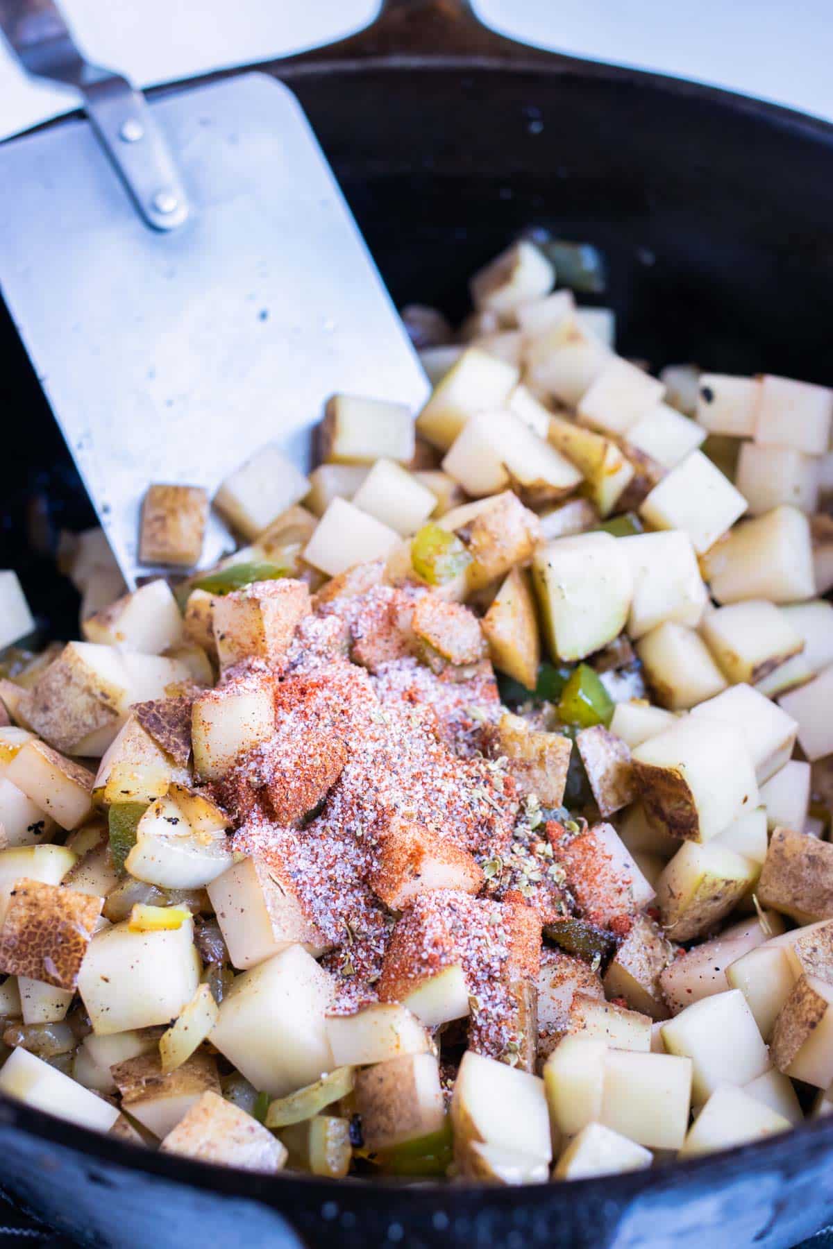 Potatoes and veggies are cooked together in one pot.