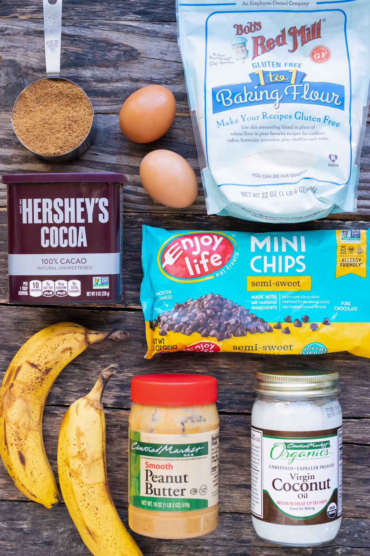 Chocolate chips, mashed bananas, peanut butter, coconut oil, cocoa powder and other ingredients are used in these double chocolate banana muffins.