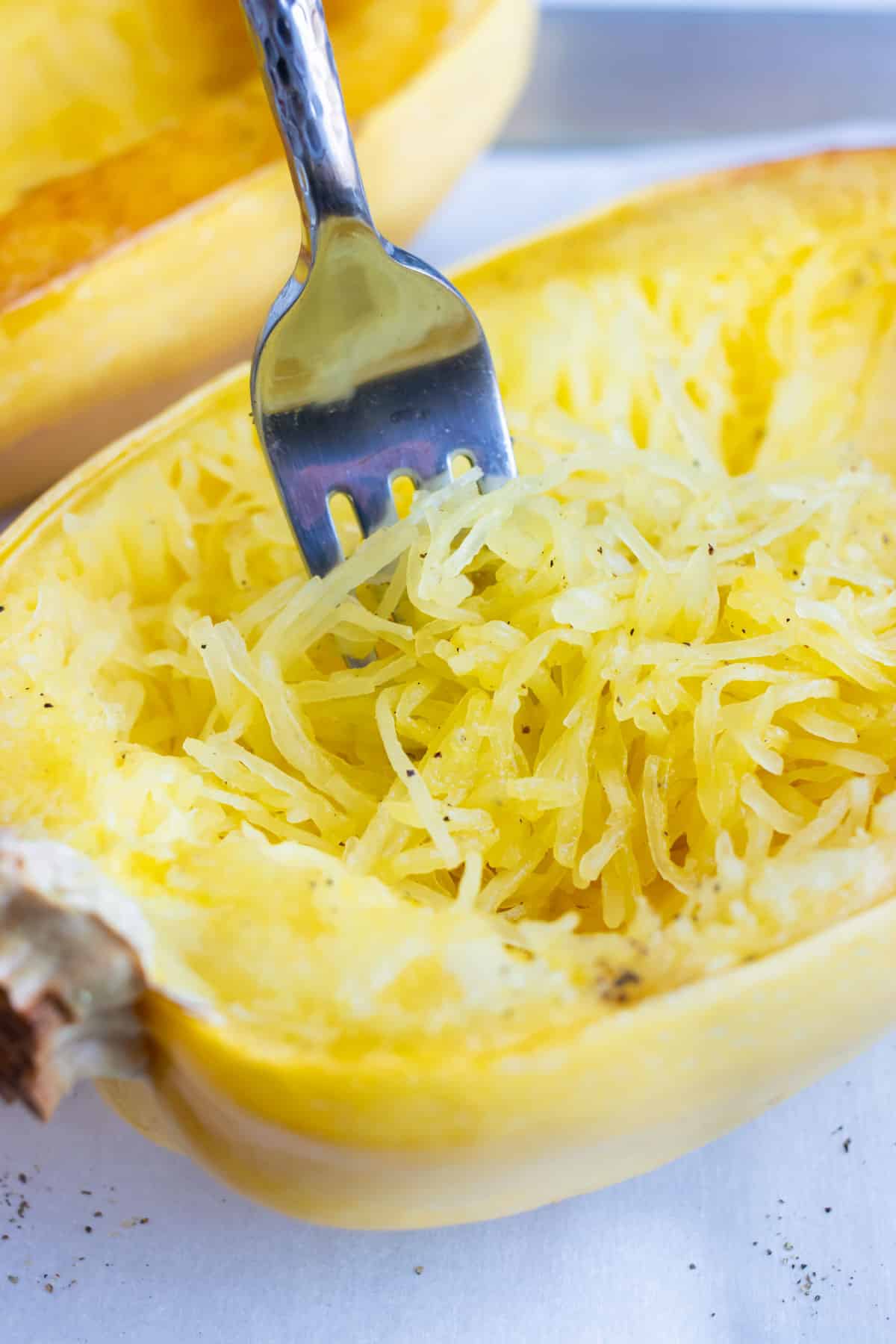 Learn how to roast spaghetti squash so you can easily shred it with a fork.