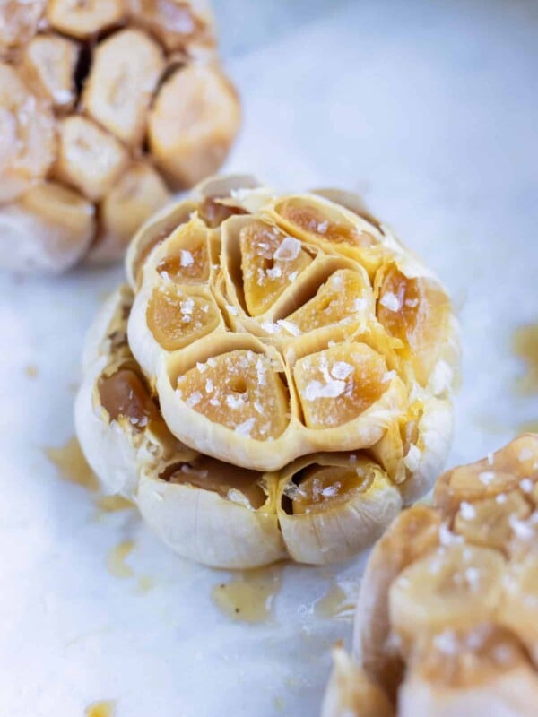 Flavorful roasted garlic is set on the counter before adding to recipes.