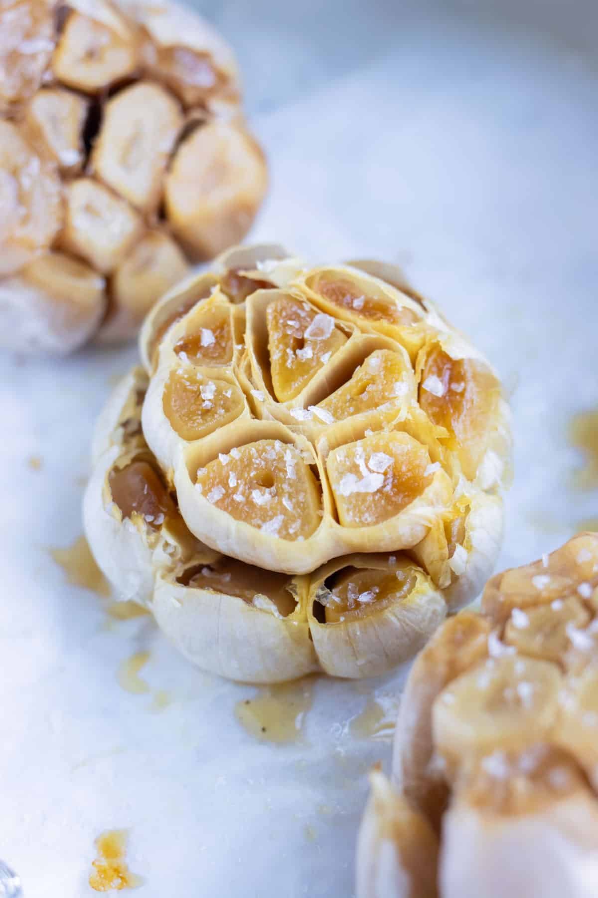 Flavorful roasted garlic is set on the counter before adding to recipes.