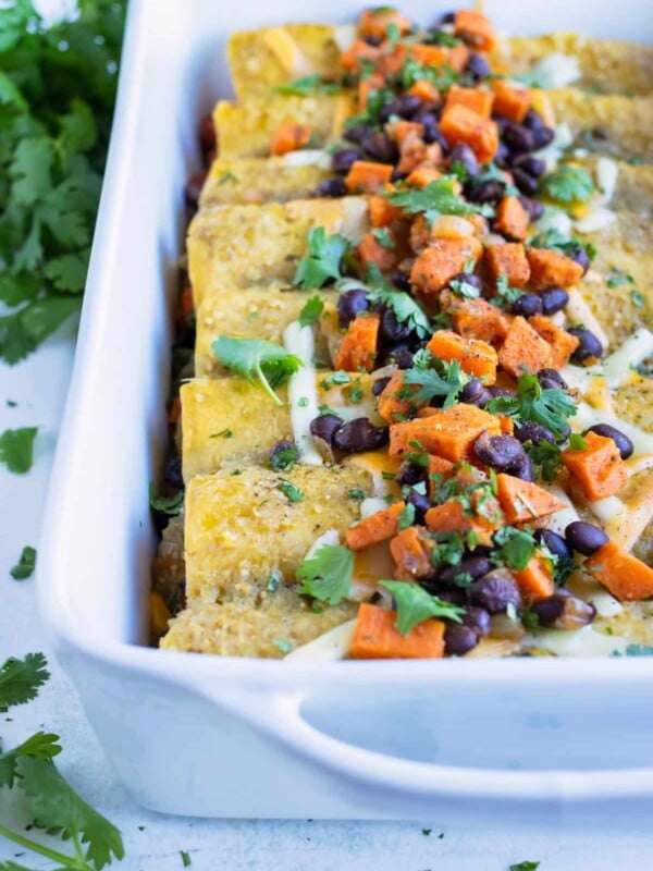 Healthy vegetarian enchiladas are served for a Mexican inspired dinner.