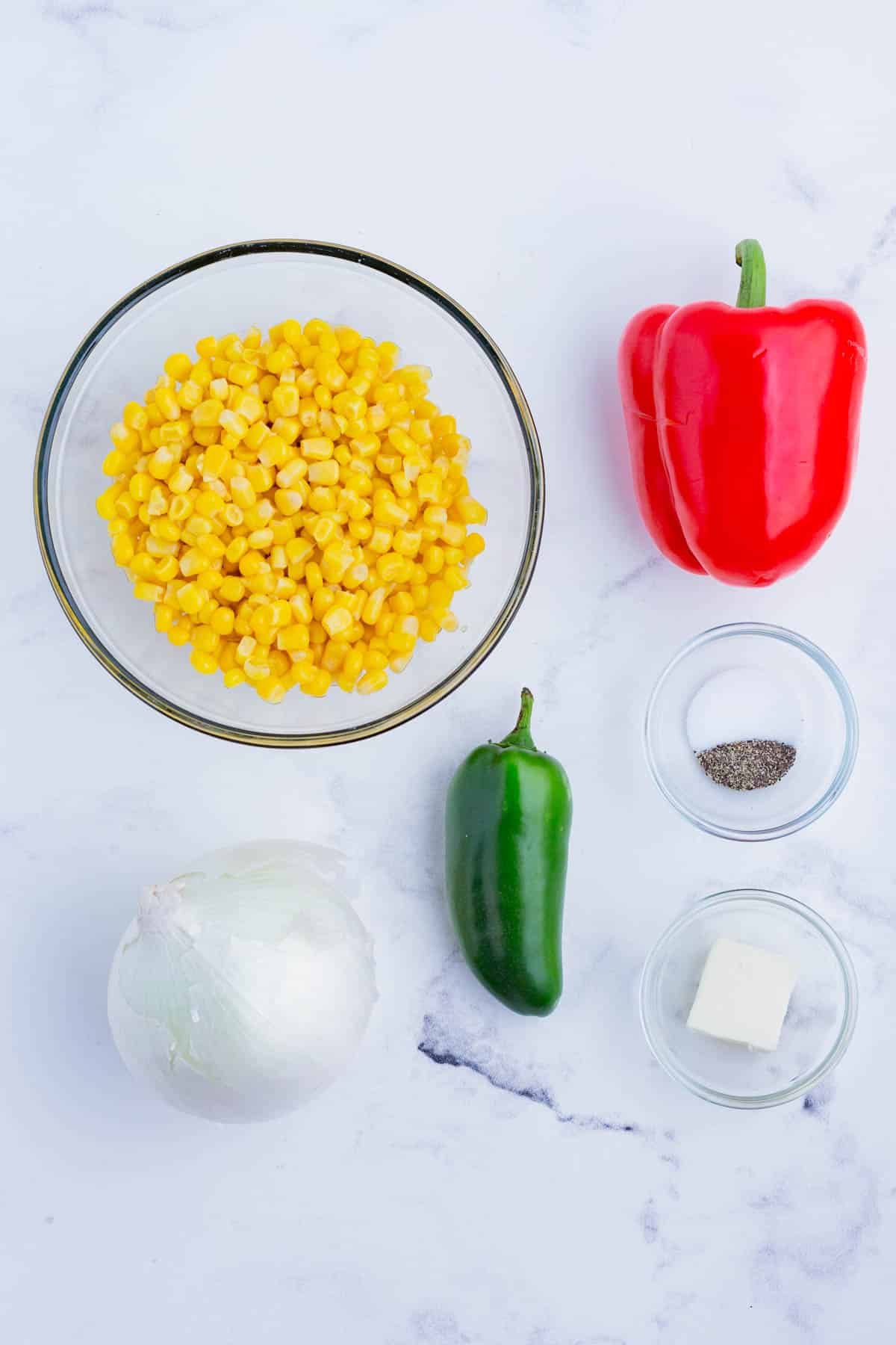 The corn succotash ingredients include corn, peppers, onion, and seasoning.