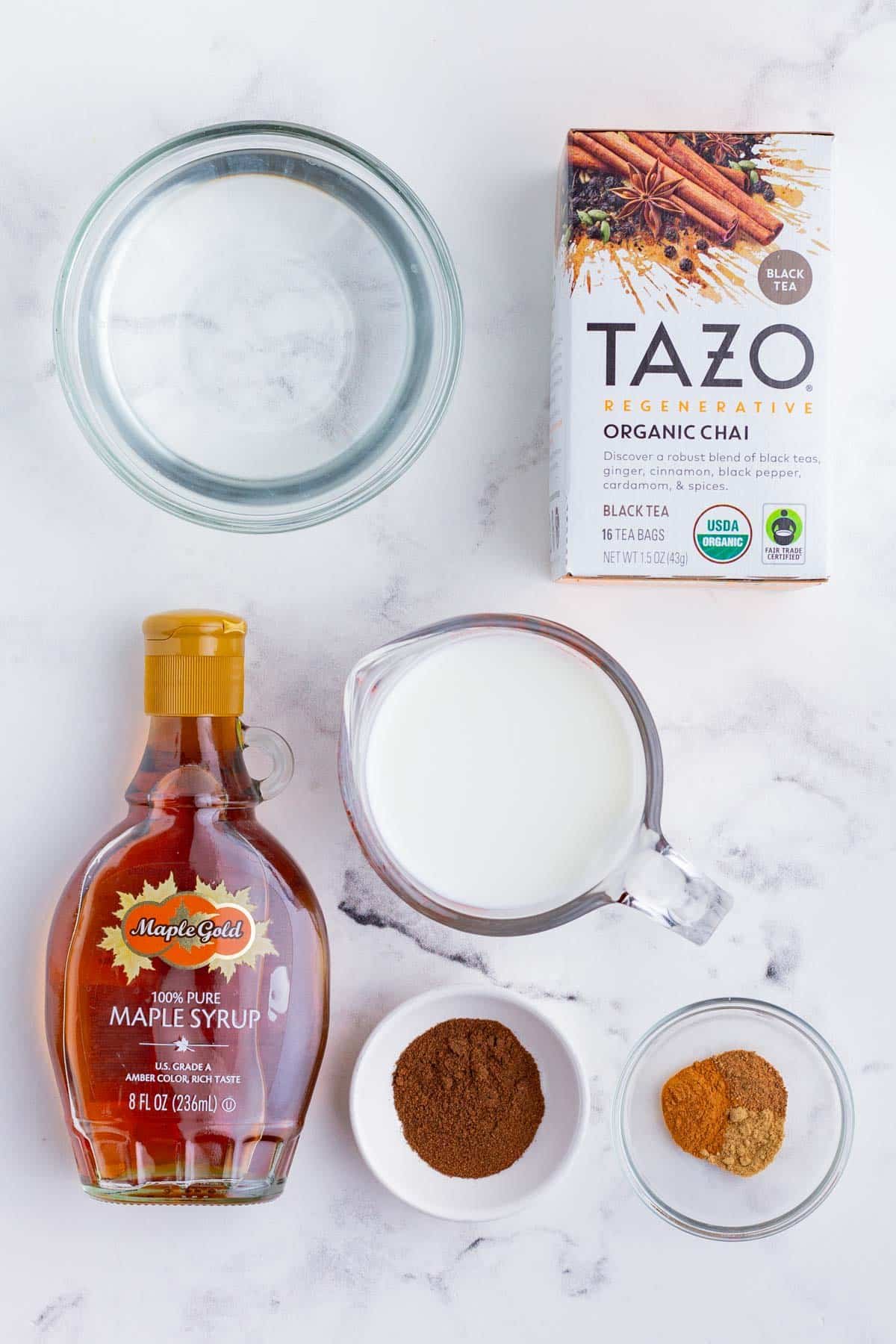 Chai tea, spices, milk, sweetener, and water are the ingredients needed for an iced Chai tea latte.