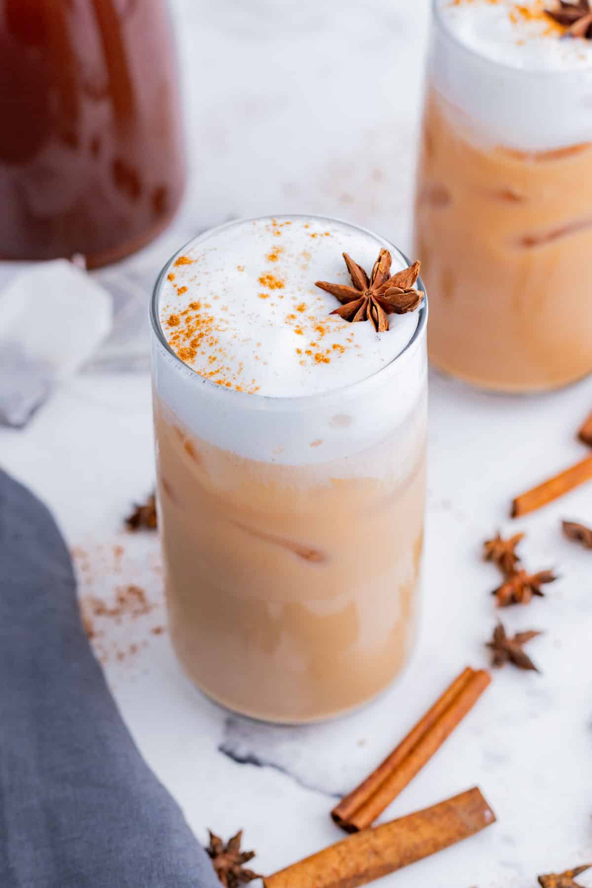 Warm spices, like cinnamon and star anise, top glasses of Iced Chai.