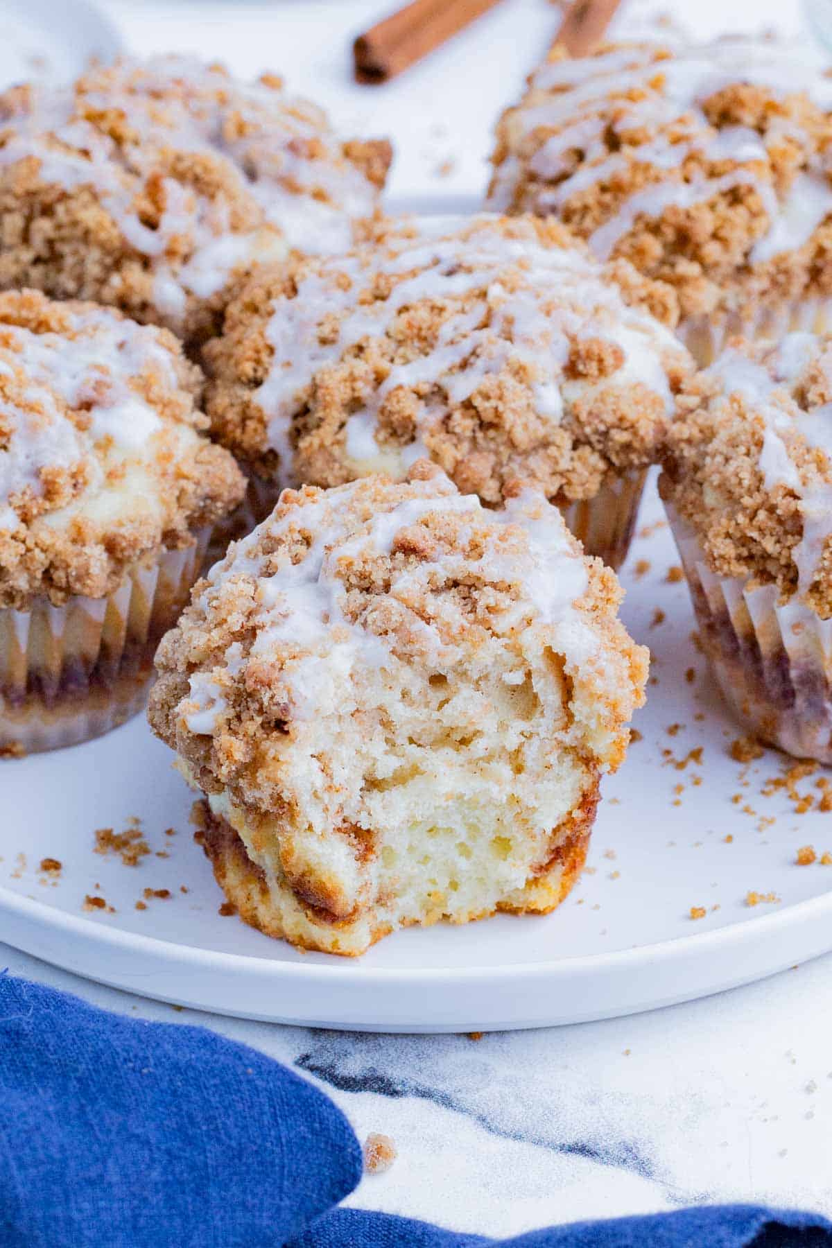 Coffee cake cupcakes are topped with cinnamon streusel and a sweet glaze.