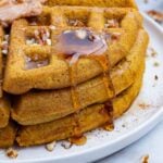 Pumpkin waffles topped with syrup and maple butter is a perfect fall morning.