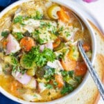 A bowl full of an Instant Pot chicken soup recipe with vegetables.
