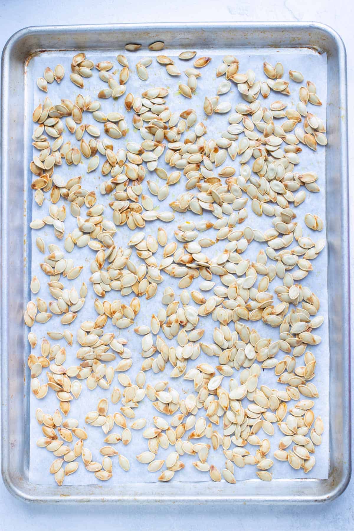 Toasted pumpkin seeds are baked in the oven.