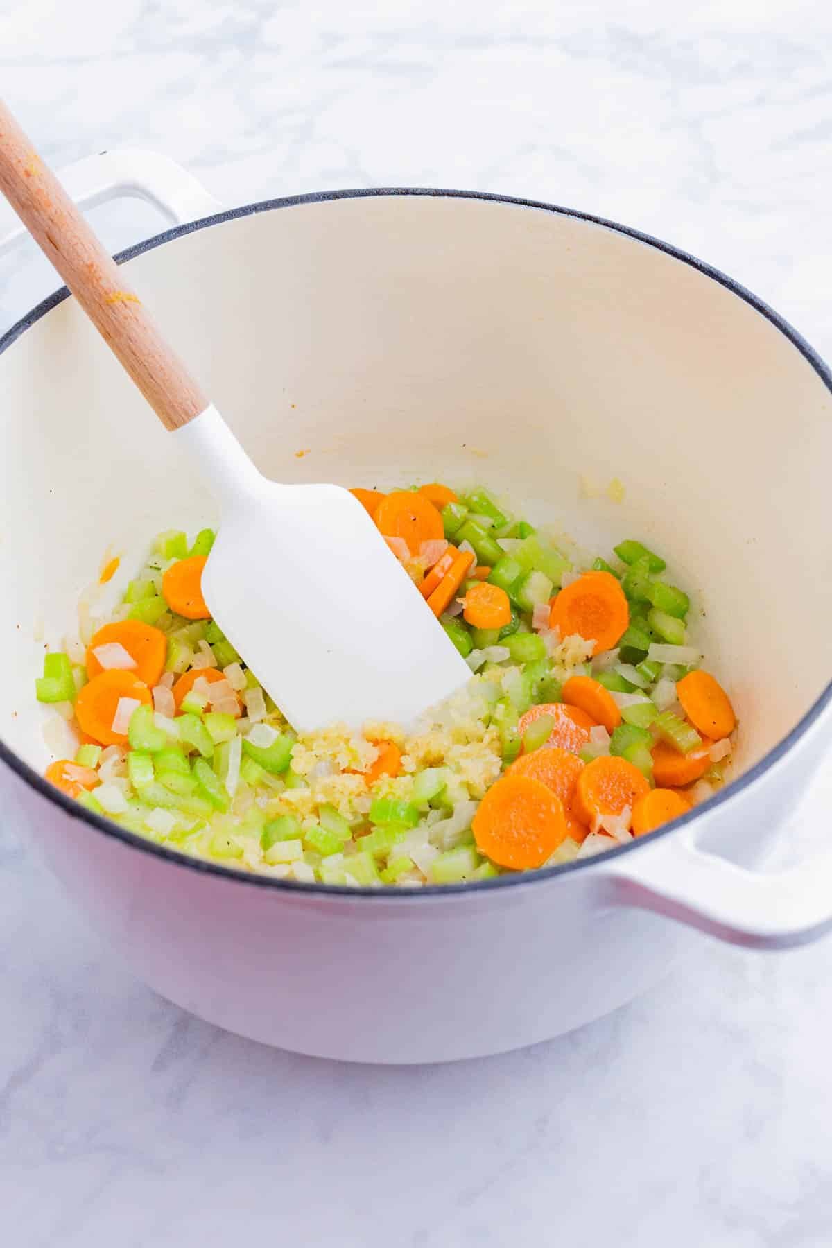 Carrots, onion, and celery are cooked in butter.