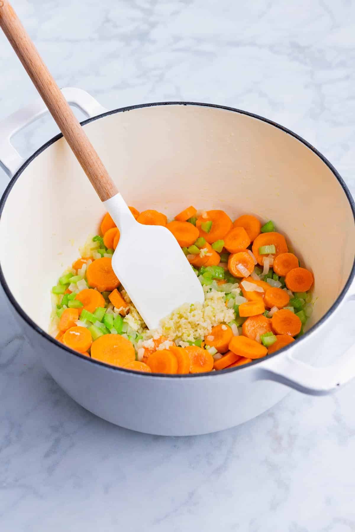 Garlic is added to the mixed veggies.