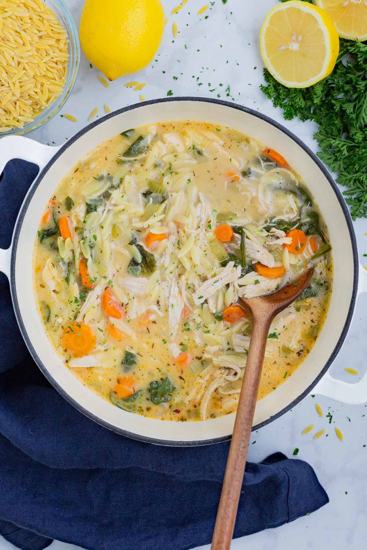 Lemon chicken orzo soup is full of healthy veggies, tender chicken, orzo pasta all in a creamy, lemony broth.