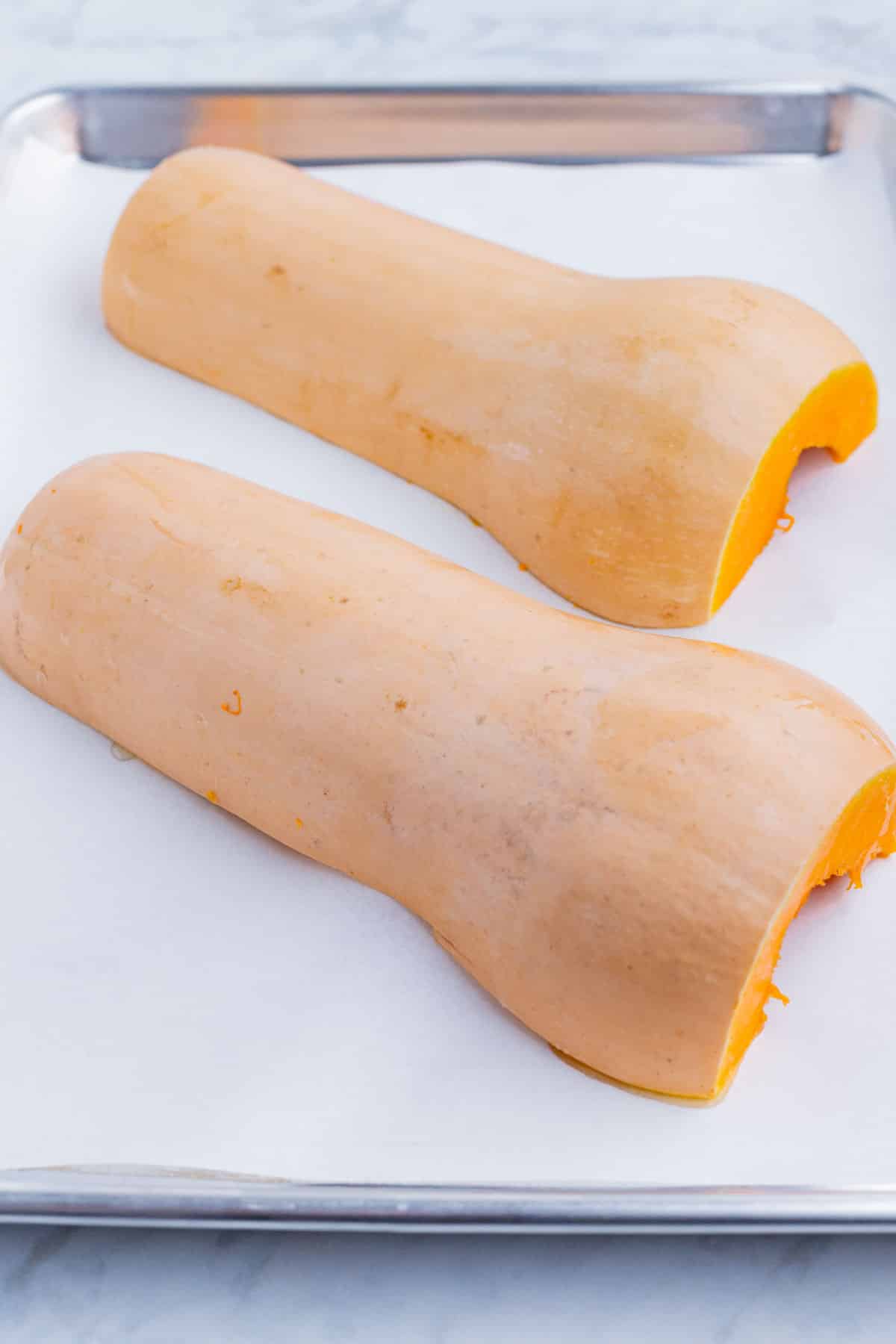 The butternut squash is roasted cut side down.
