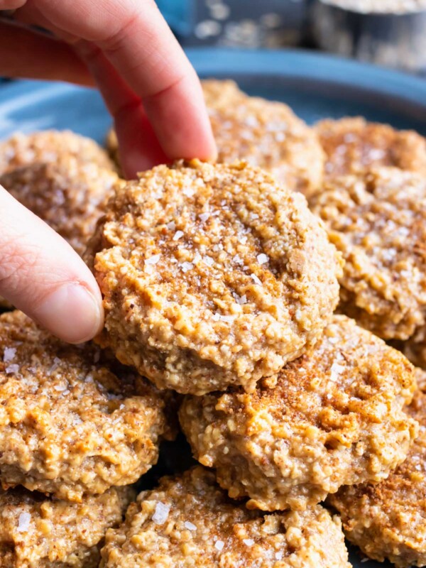 Gluten-free oatmeal cookies with almond butter on a serving plate.