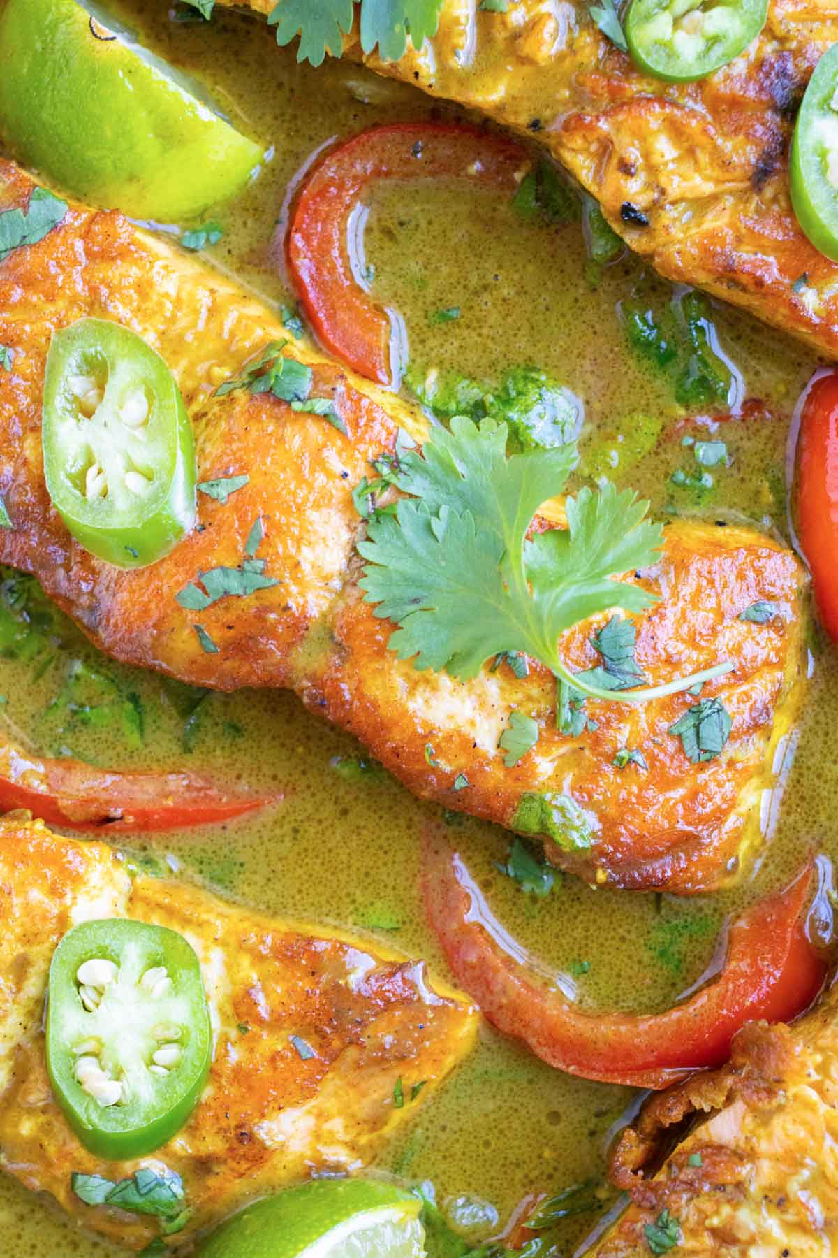 Salmon curry recipe with bell peppers and onion in a coconut milk sauce.