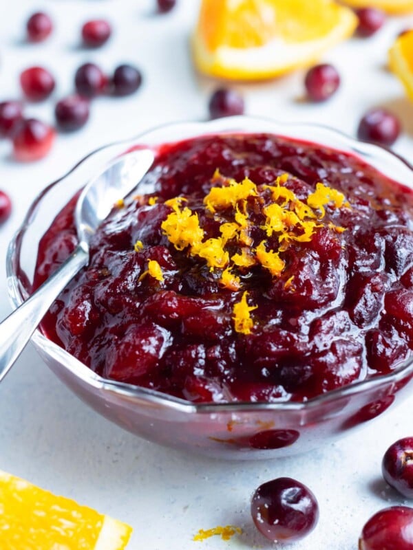 Cranberry orange sauce in a bowl is set on the counter.