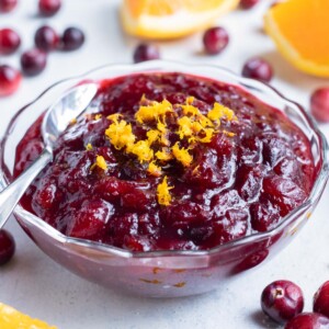 Fresh cranberry sauce is served in a glass bowl.