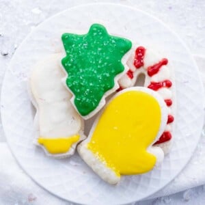 Sugar cookies are decorated with icing and sprinkles.