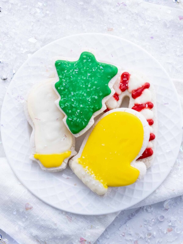 Sugar cookies are decorated with icing and sprinkles.
