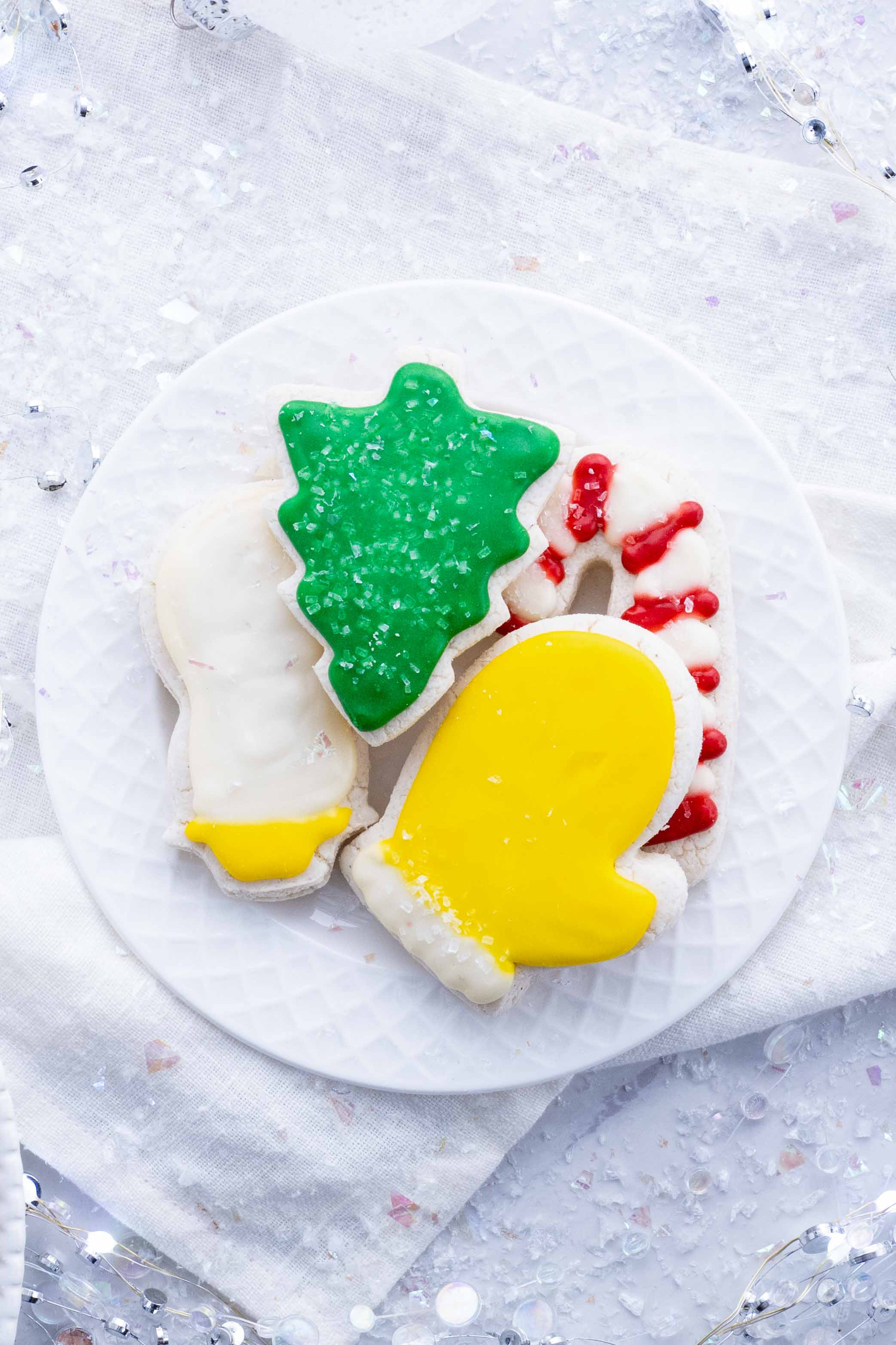 Sugar cookies are decorated with icing and sprinkles.