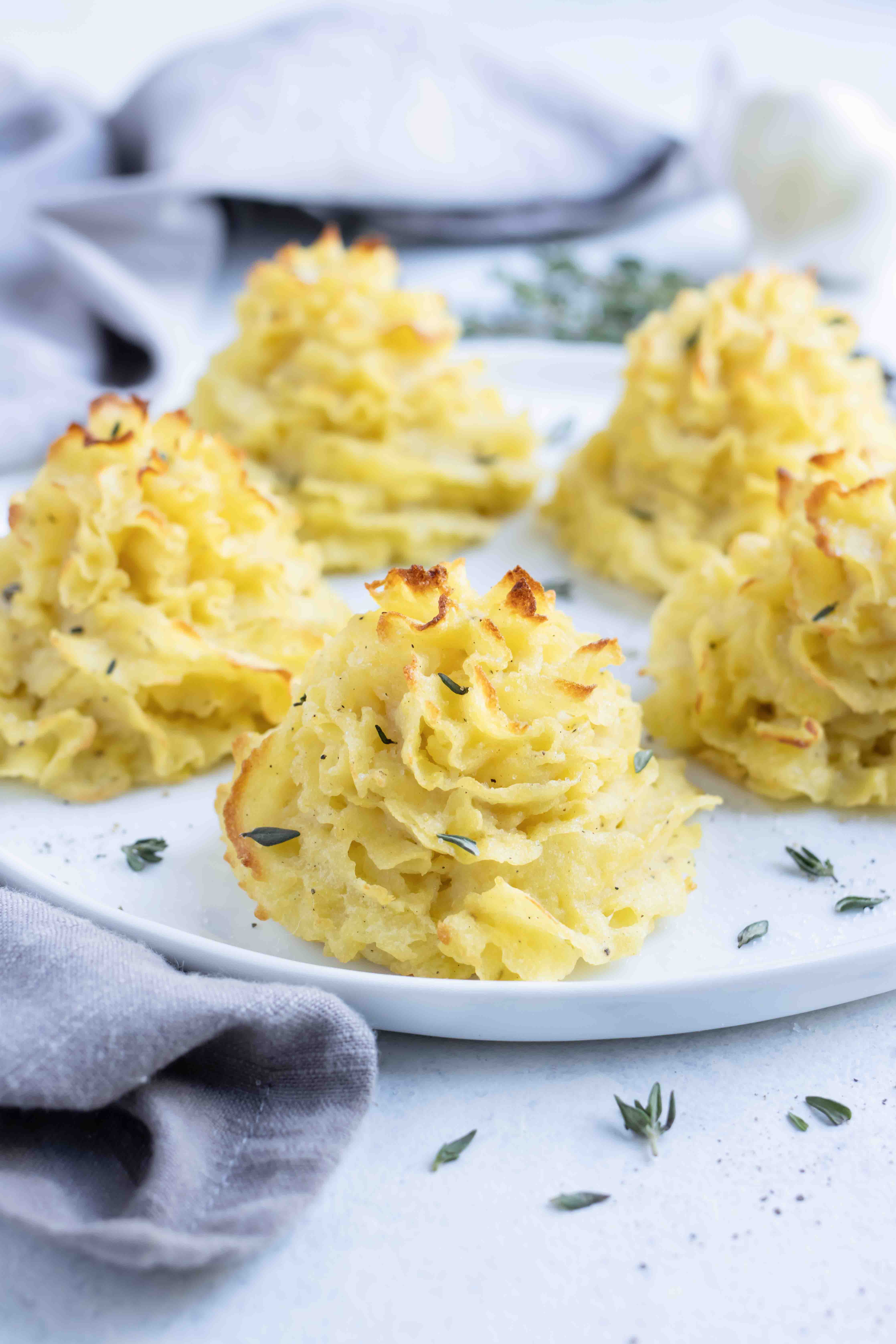 A plate is used to serve these decadent duchess potatoes.