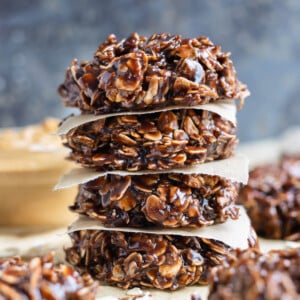 Easy to make no-bake cookies are shown stacked on the counter.