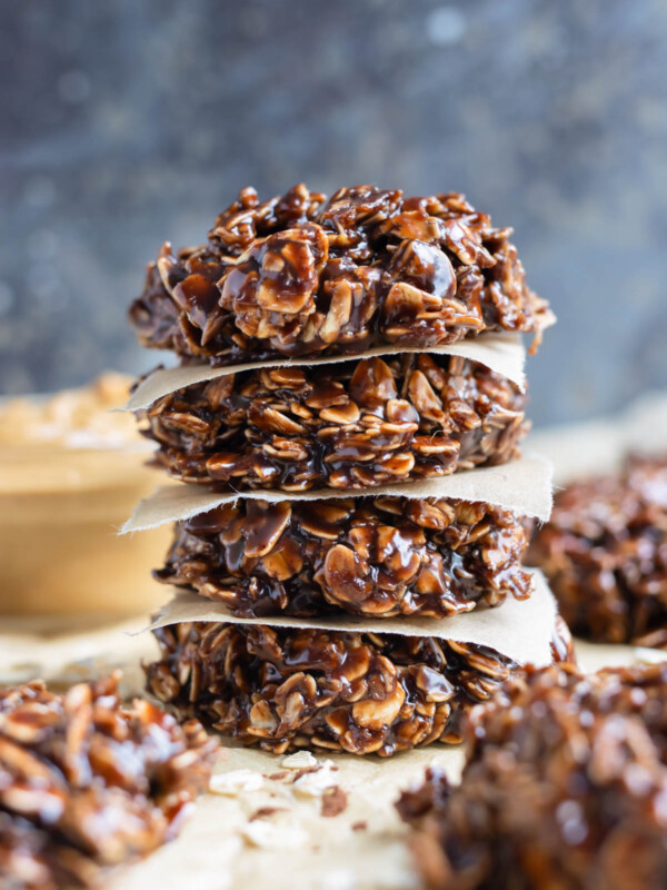 Easy to make no-bake cookies are shown stacked on the counter.