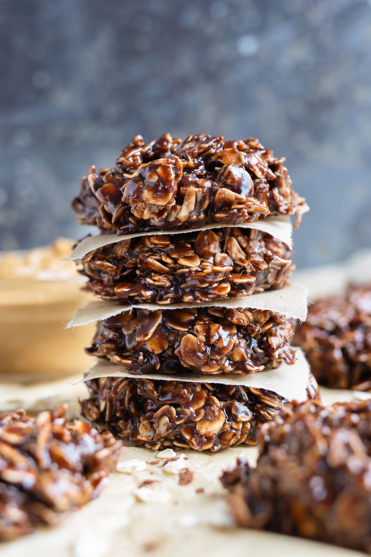 Easy to make no-bake cookies are shown stacked on the counter.