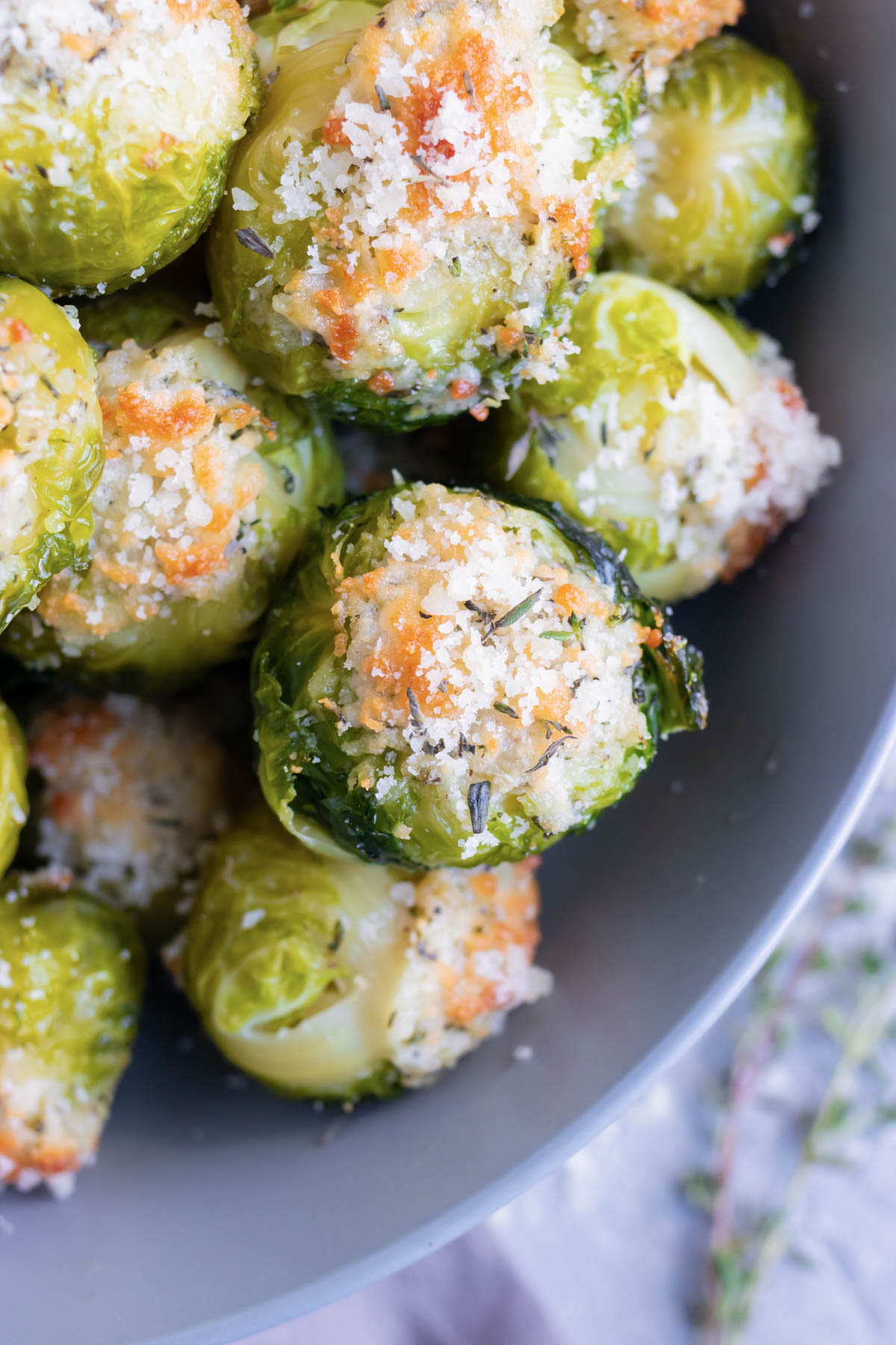 Roasted Brussels sprouts that are topped with Parmesan cheese and served as a healthy Thanksgiving, Christmas, or Easter side dish recipe.