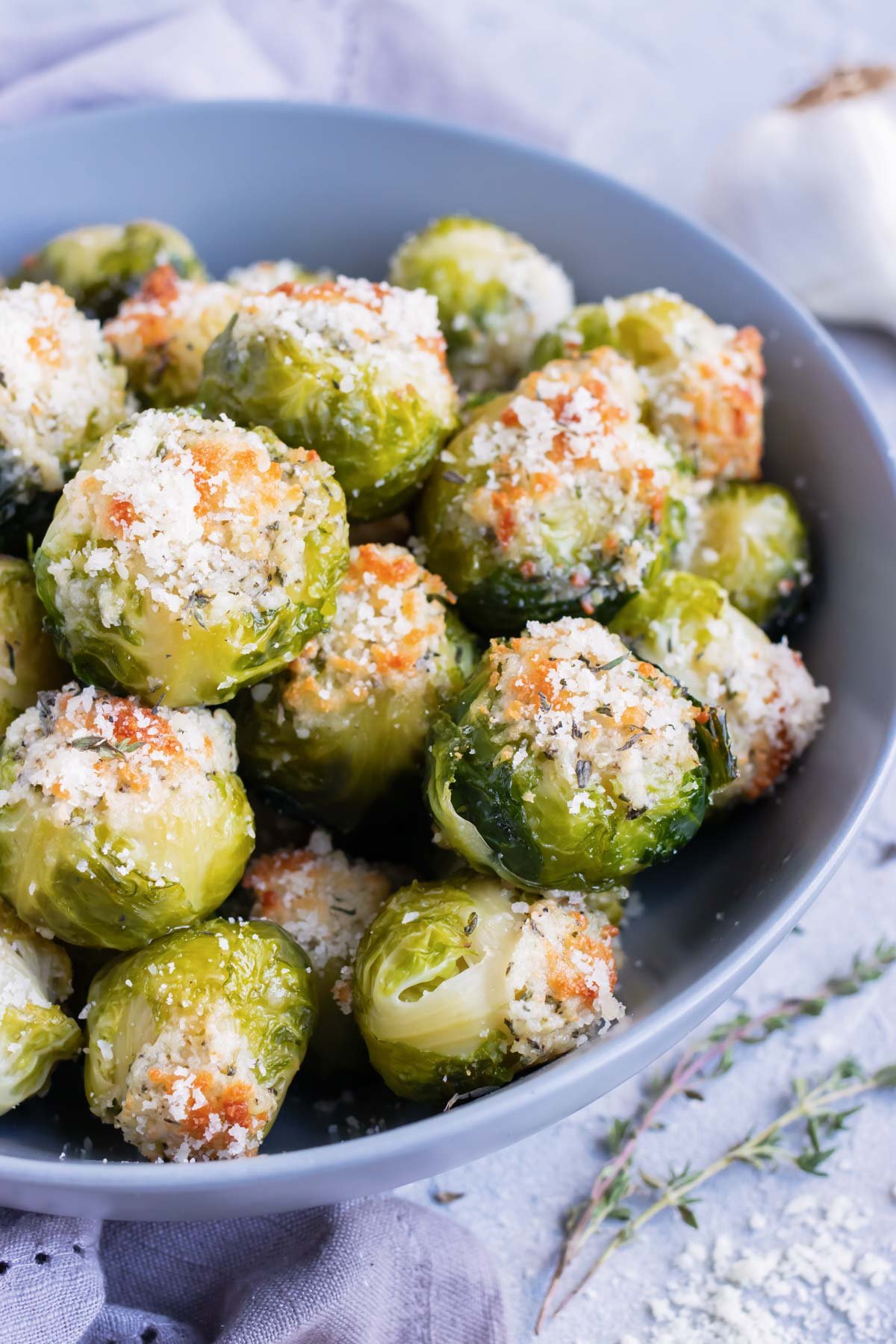 Roasted Brussels sprouts that are topped with Parmesan cheese and served as a healthy Thanksgiving, Christmas, or Easter side dish recipe.