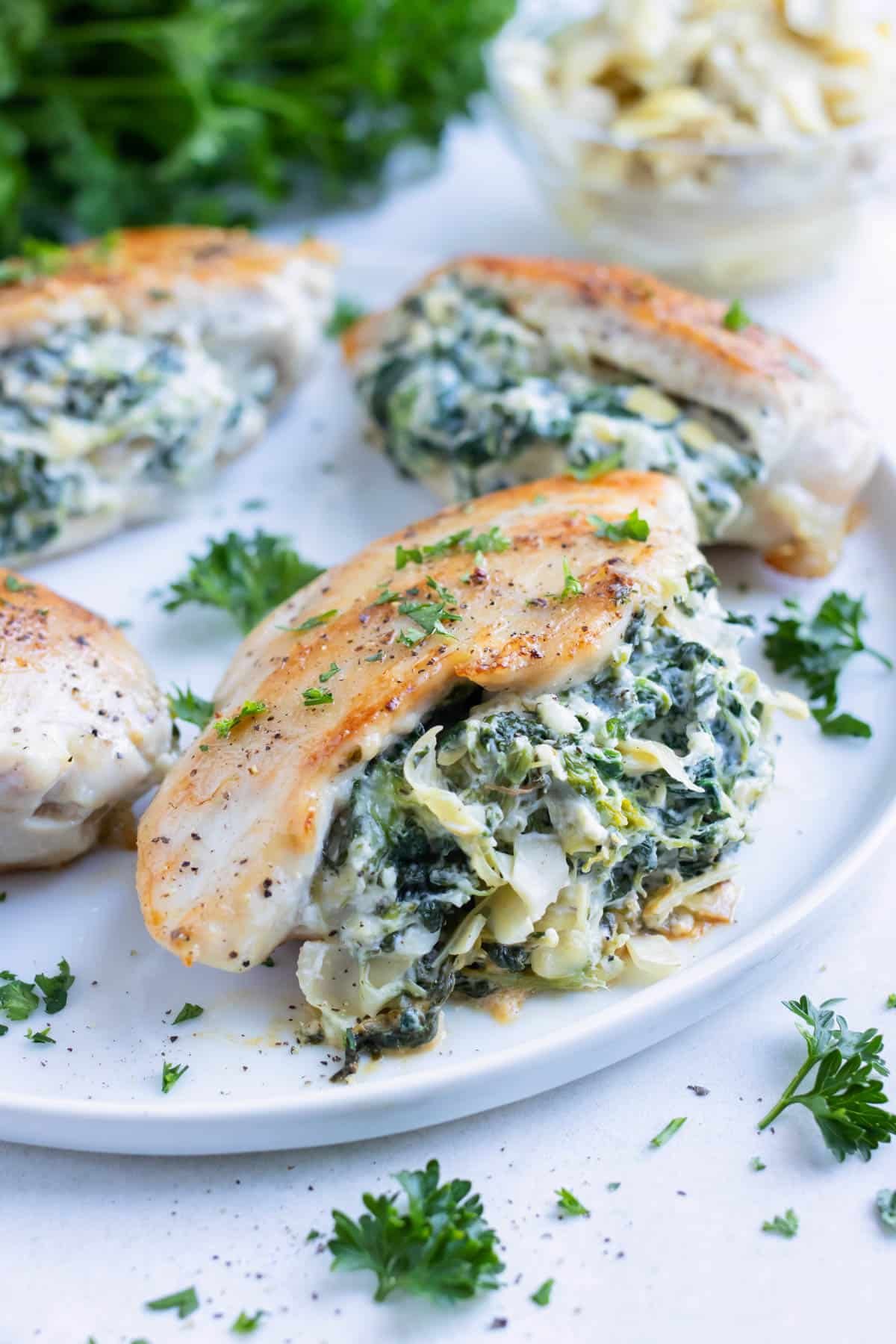 Low carb spinach artichoke chicken is served as a healthy, keto dinner.