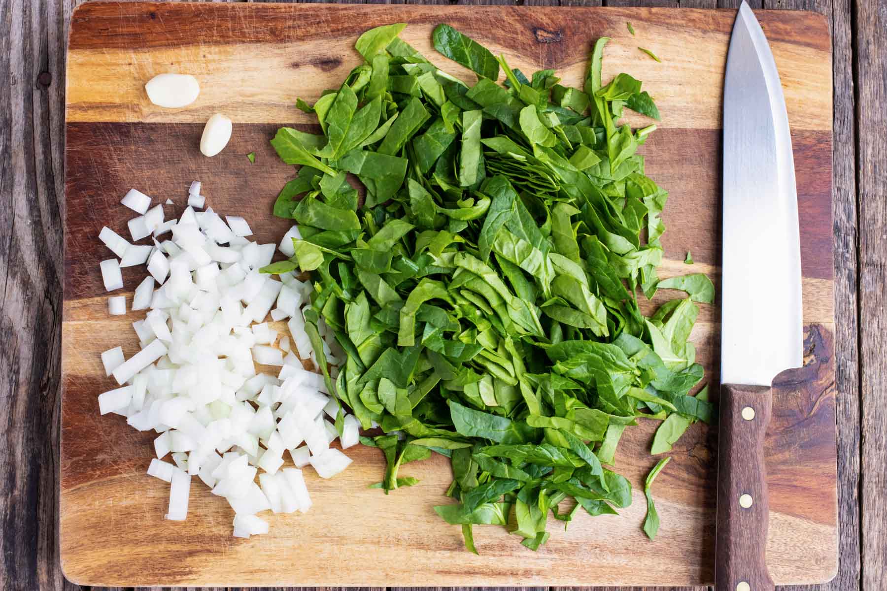Finely chopped fresh spinach and diced onion to go into a spinach crustless quiche recipe.