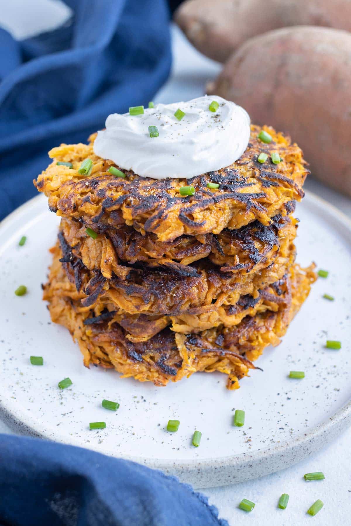 A plateful of shredded sweet potato hash browns made ahead for a breakfast crowd.