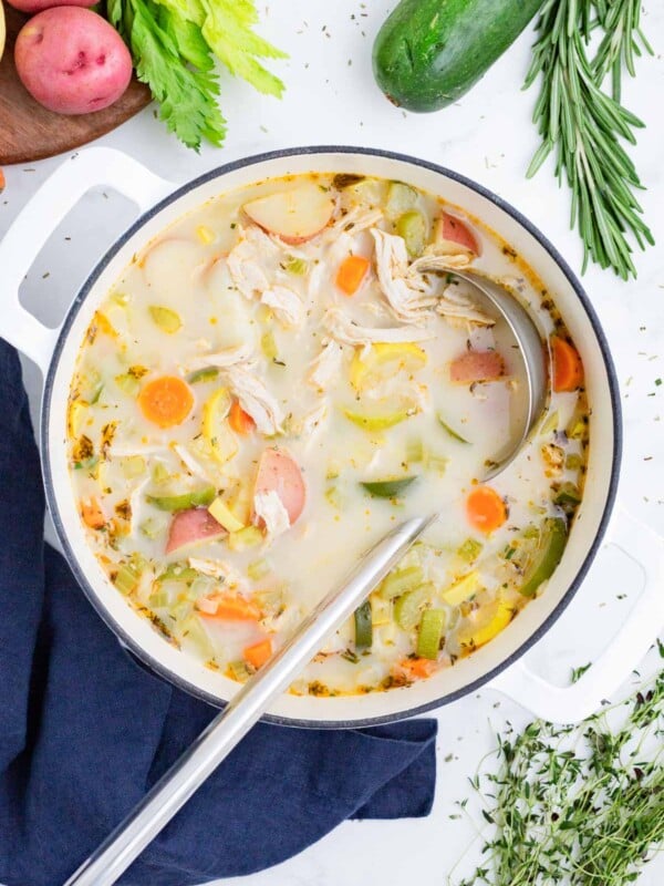 Chicken vegetable soup in a large Dutch oven.