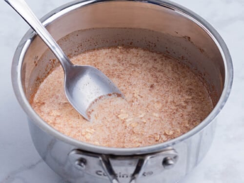 The oatmeal mixture is cooked.