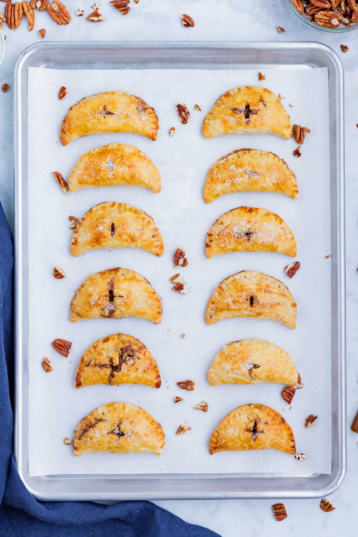 Pecan hand pies are baked until golden in the oven.