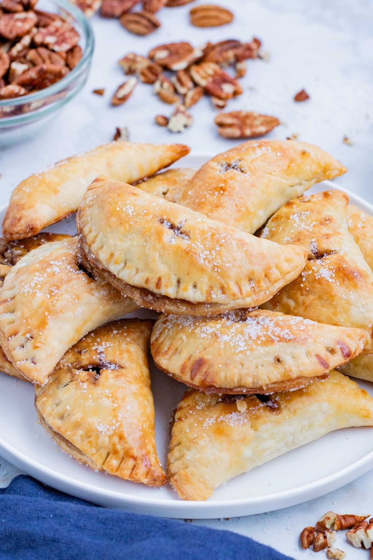 Pecan Hand Pies RECIPE served on a white dish.