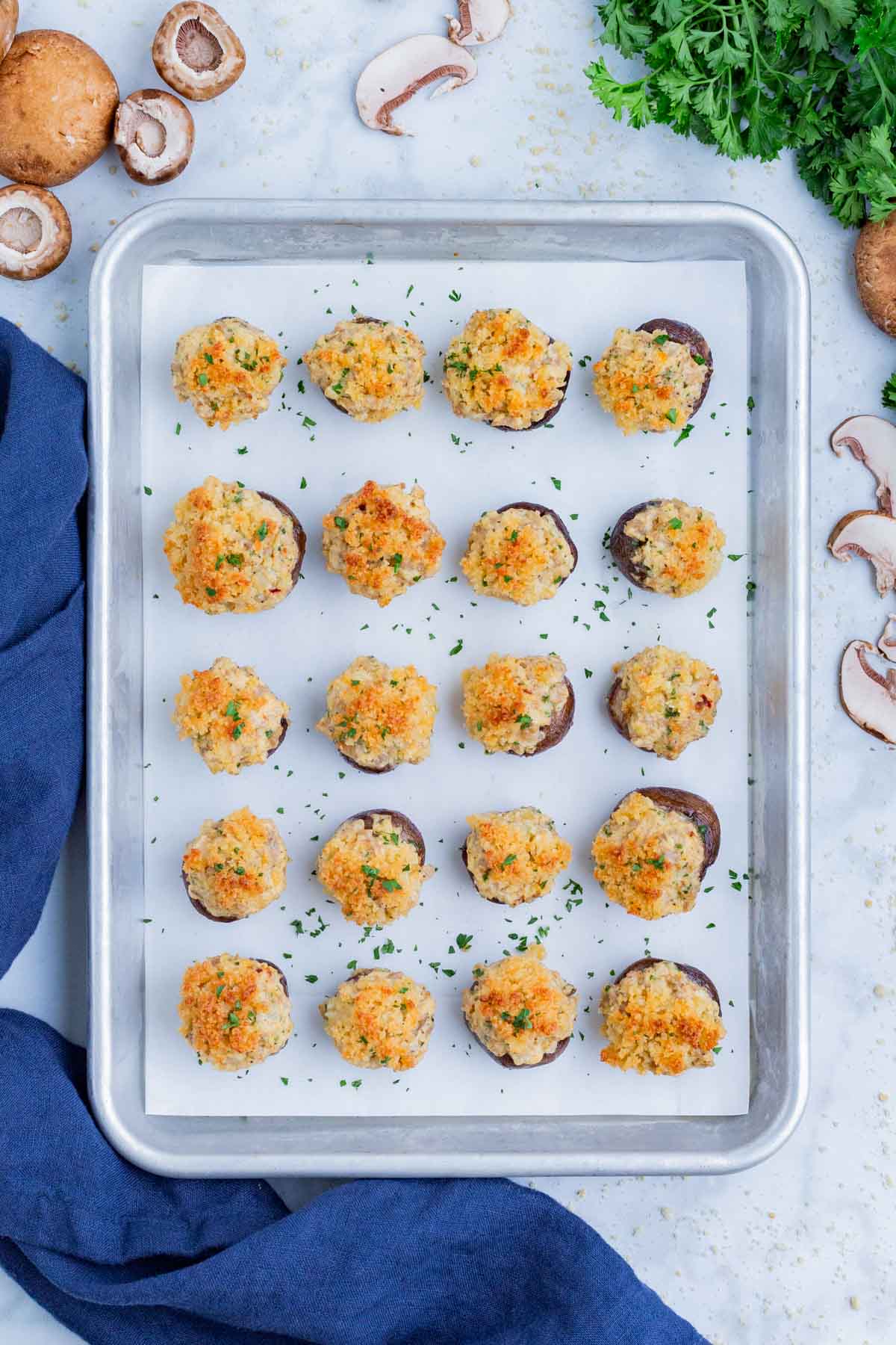 Stuffed mushrooms are baked in the oven until golden brown.