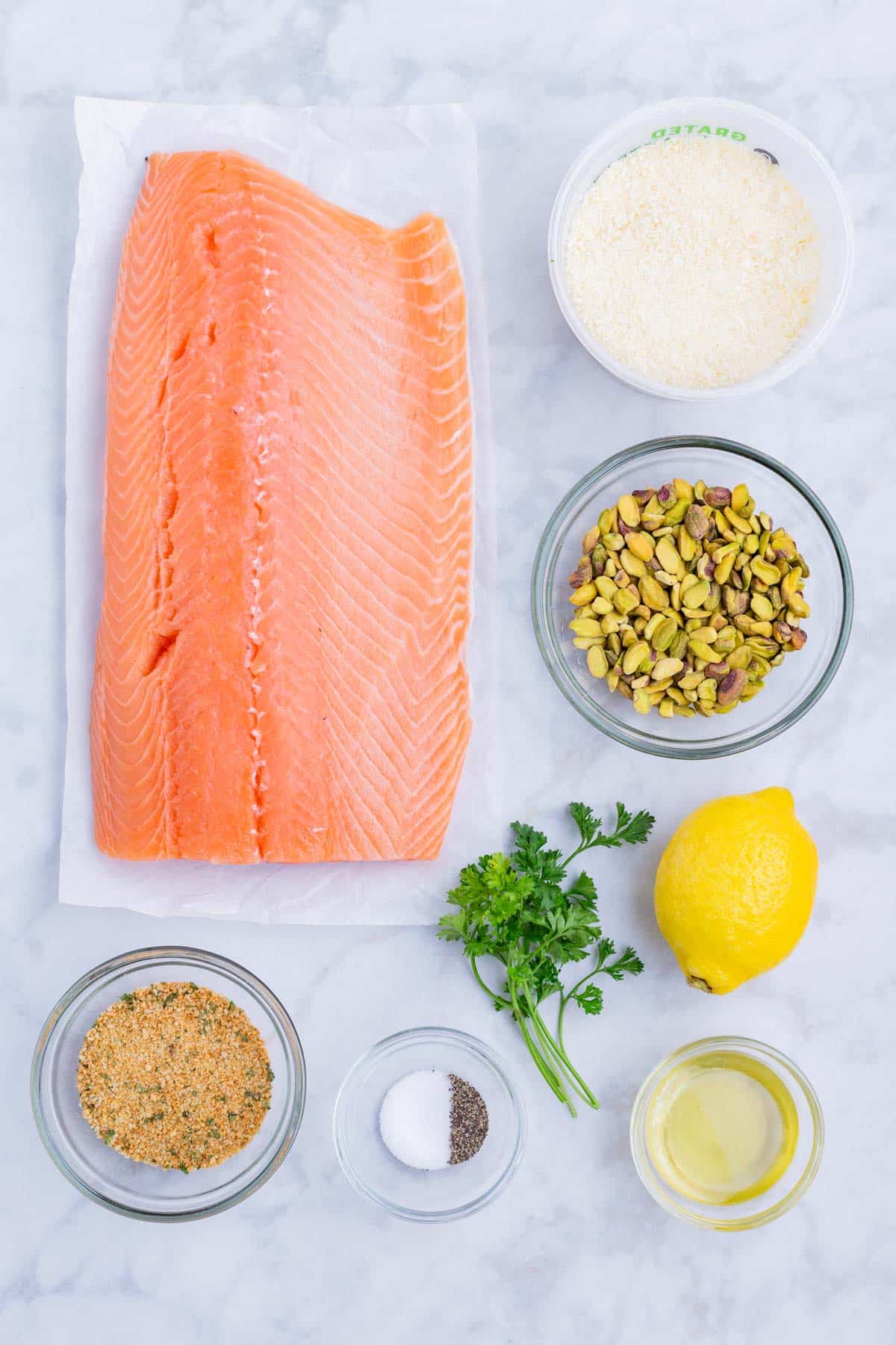 The ingredients for this dish are salmon, pistachios, lemon, breadcrumbs, and herbs.