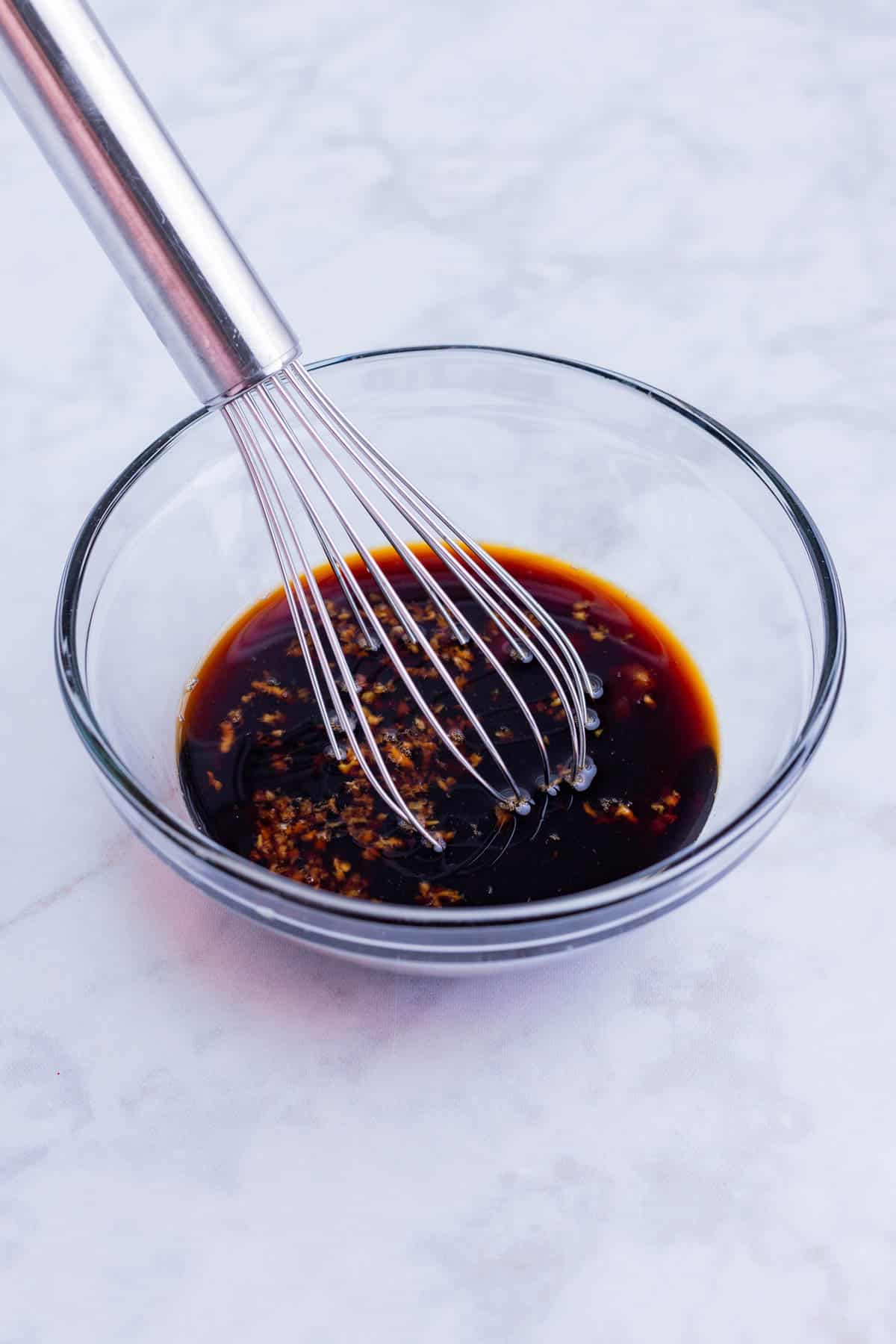 The teriyaki sauce is whisked together.