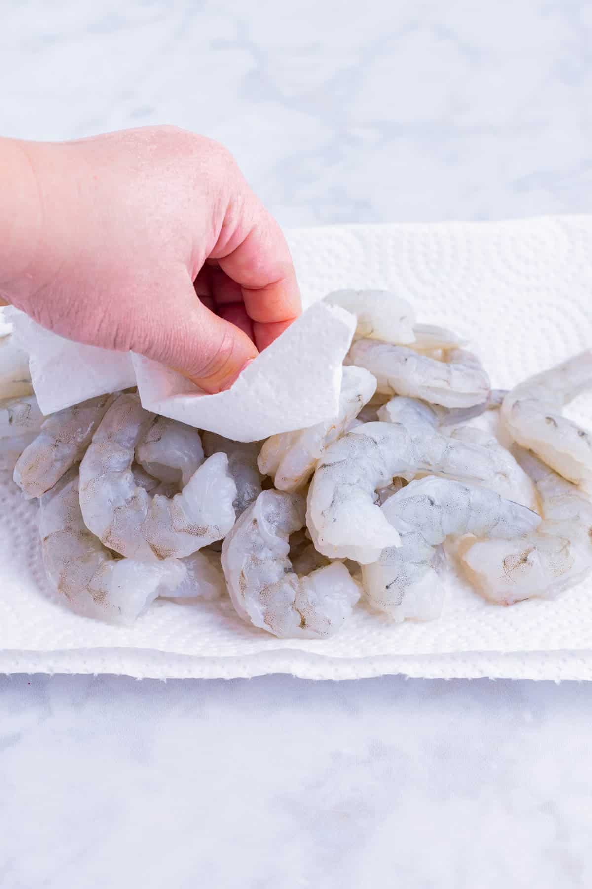 Shrimp is dried off before cooking.