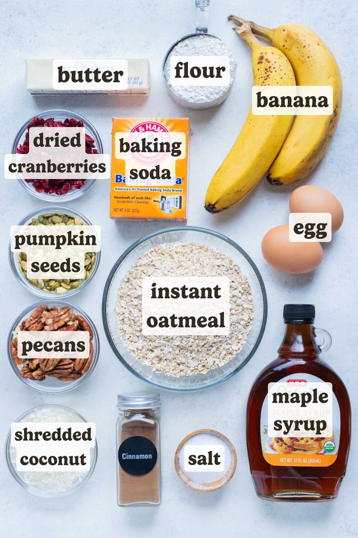 Eggs, flour, bananas, sweeteners, oats, baking soda, nuts, and dried fruit are all the ingredients in this breakfast oatmeal cookie recipe.